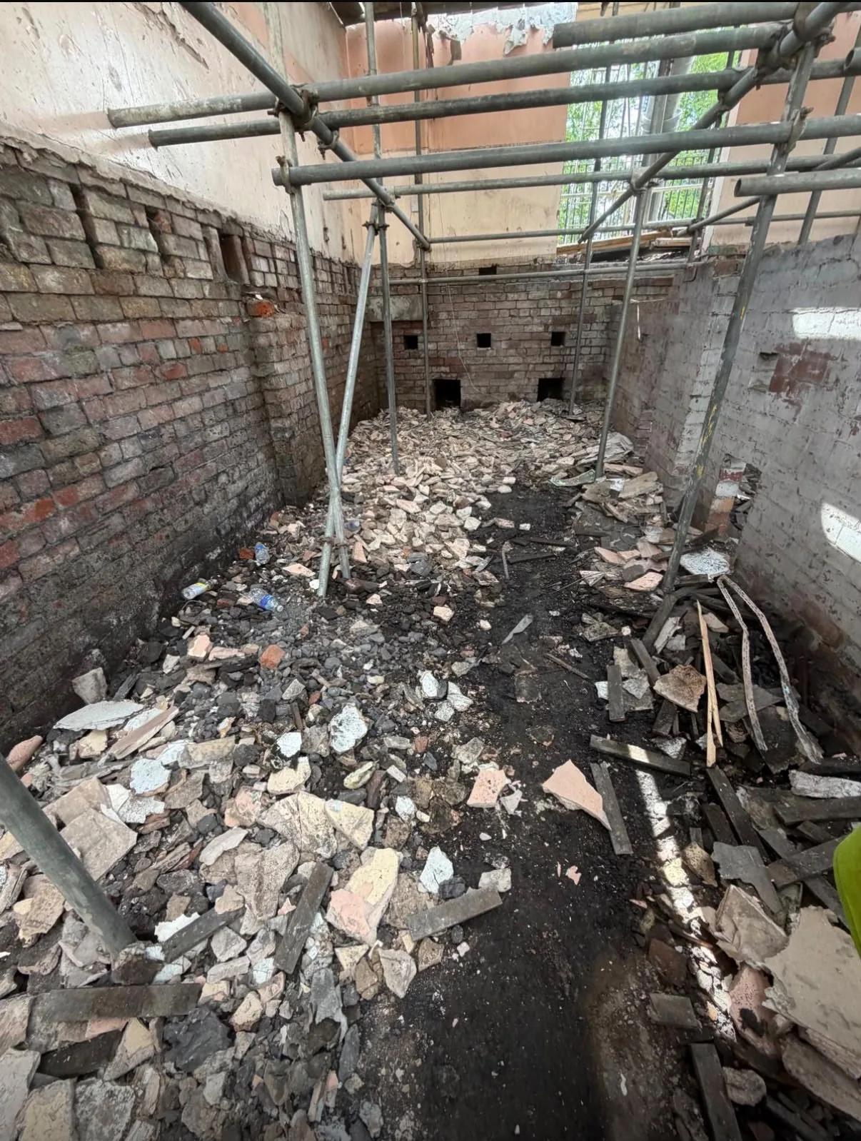 Construction area with rubble before site clearing