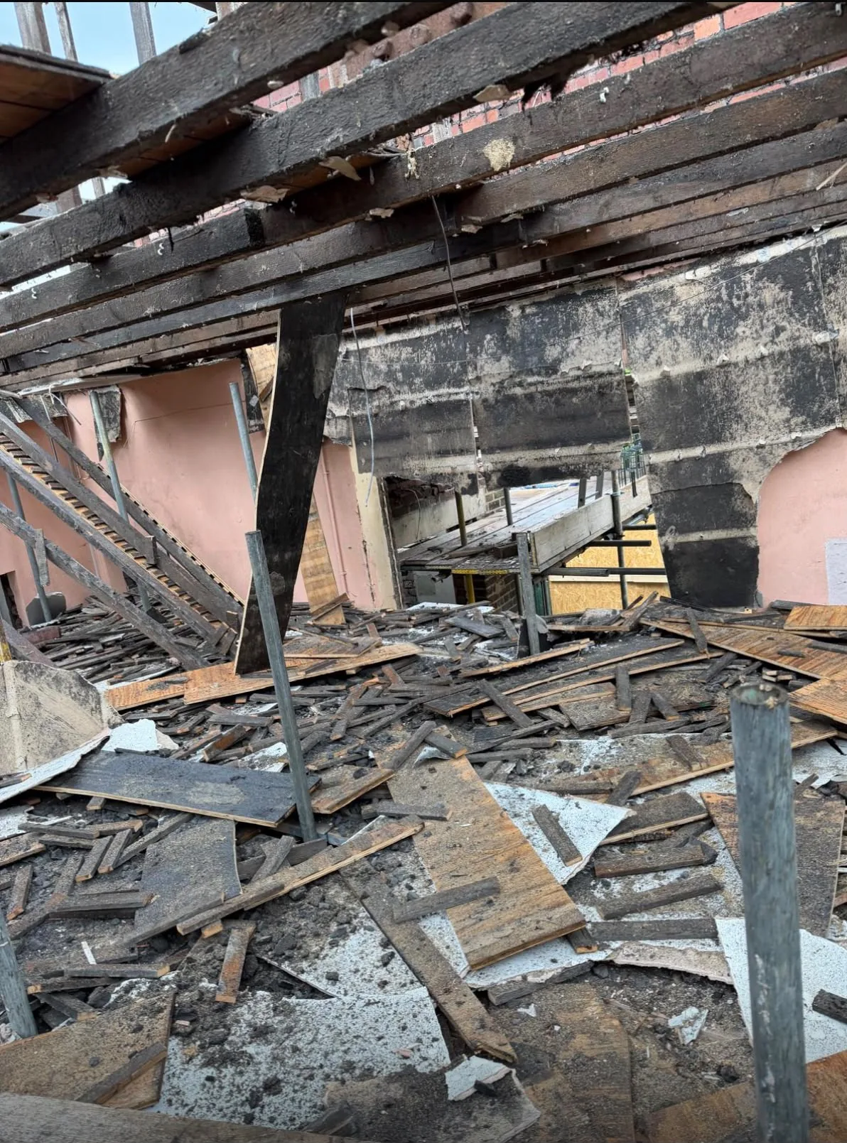 Large construction area with timber and building debris